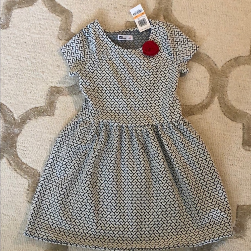 Cute knit dress with rose detail.